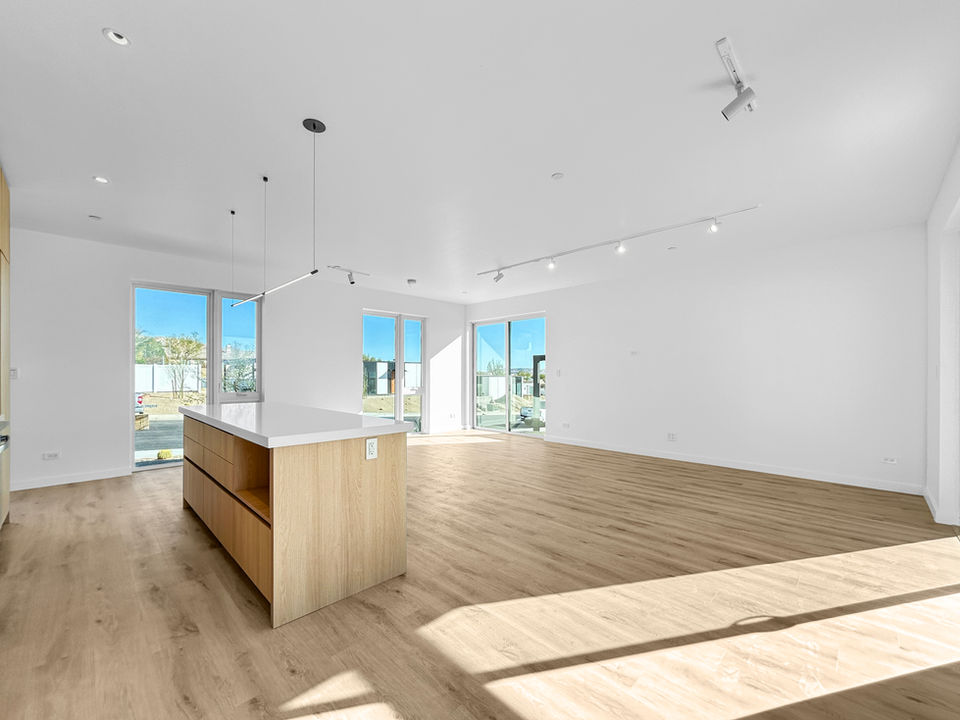 Spacious living area with floor-to-ceiling windows in the main home of Scenic Crest Villas.