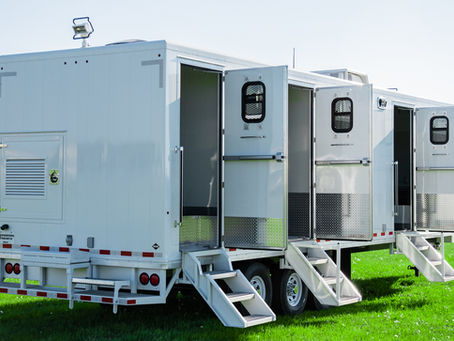 White ITB custom trailer with multiple doors and stairs