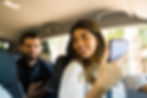 Happy rideshare passenger and driver