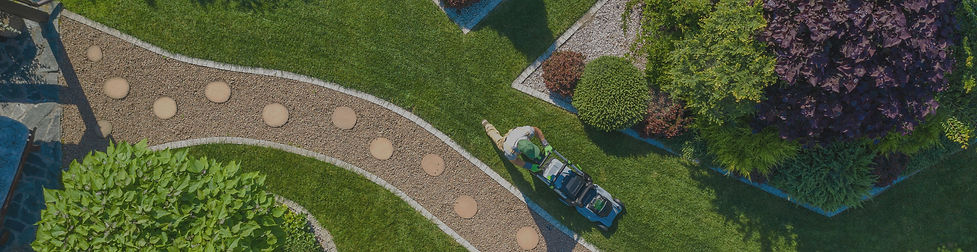 Caucasian Gardener with Grass Mower Trim