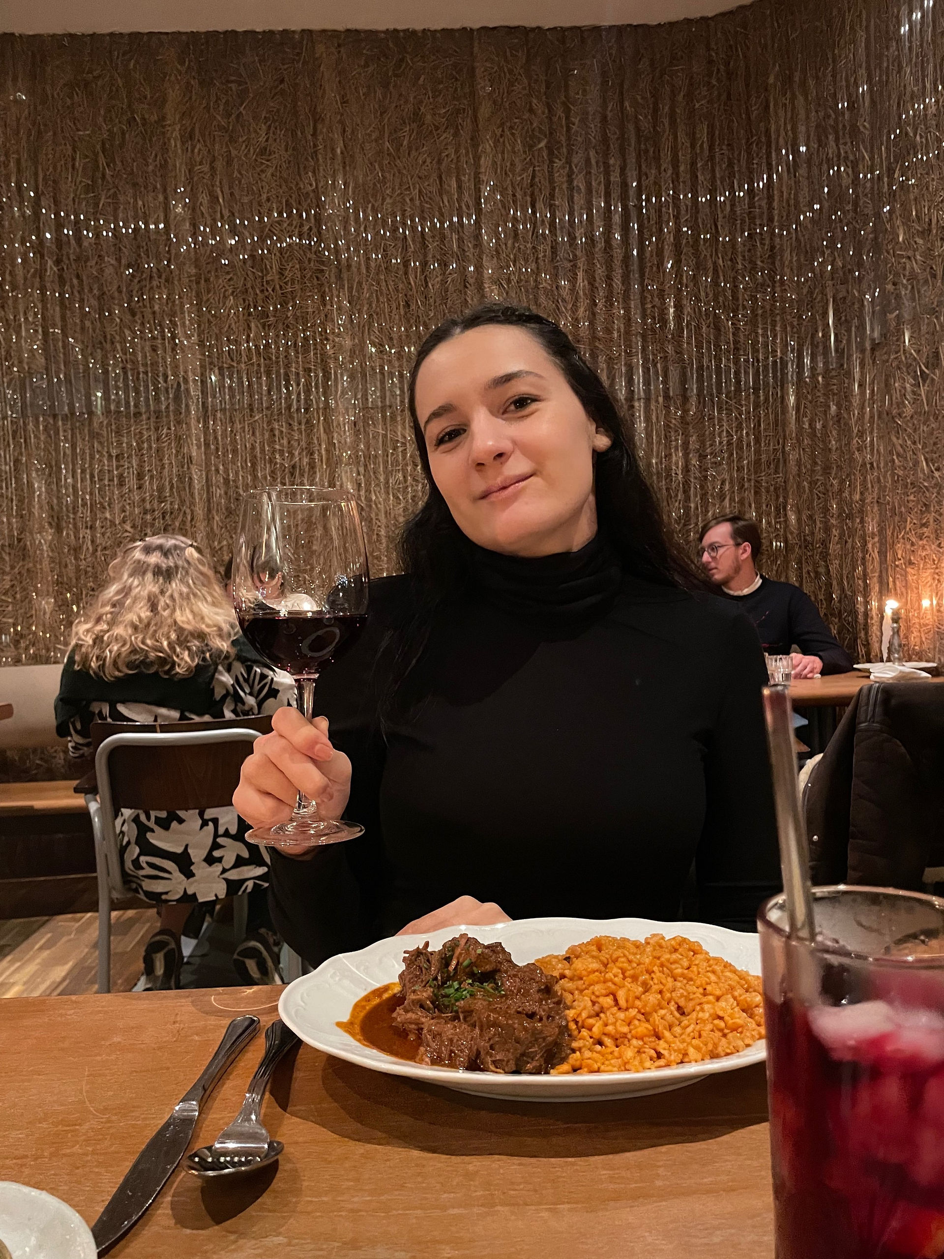 Ivankally eating a Hungarian dish at Getto Gulyas