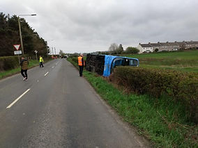 Two people hospitalised after double decker bus overturns on rural road