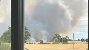 Nine fire crews battling large field blaze near Long Stratton
