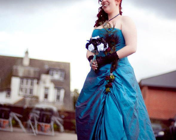 peacock blue wedding dress, with feathers and made flowers