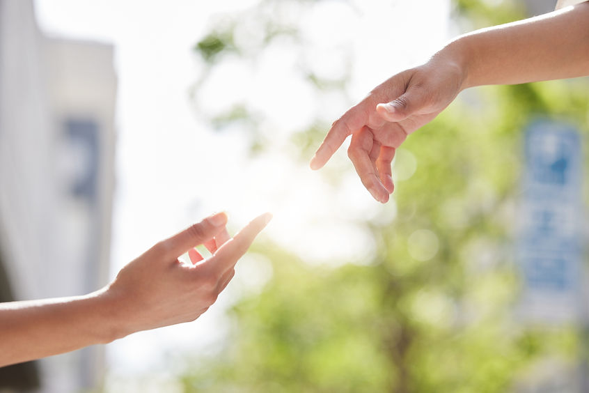hands-reaching-outward-in-bright-sunny-urban-sett-2026-03-25-08-30-42-utc.jpg