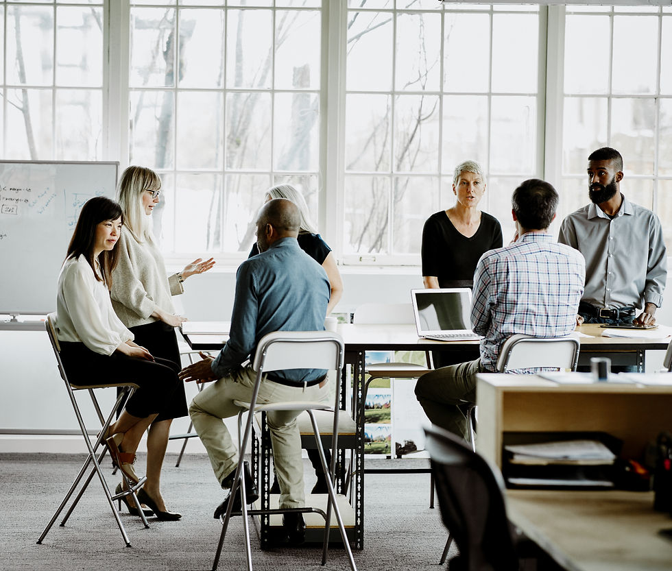 Close-up of a diverse group of employees discussing in a casual setting