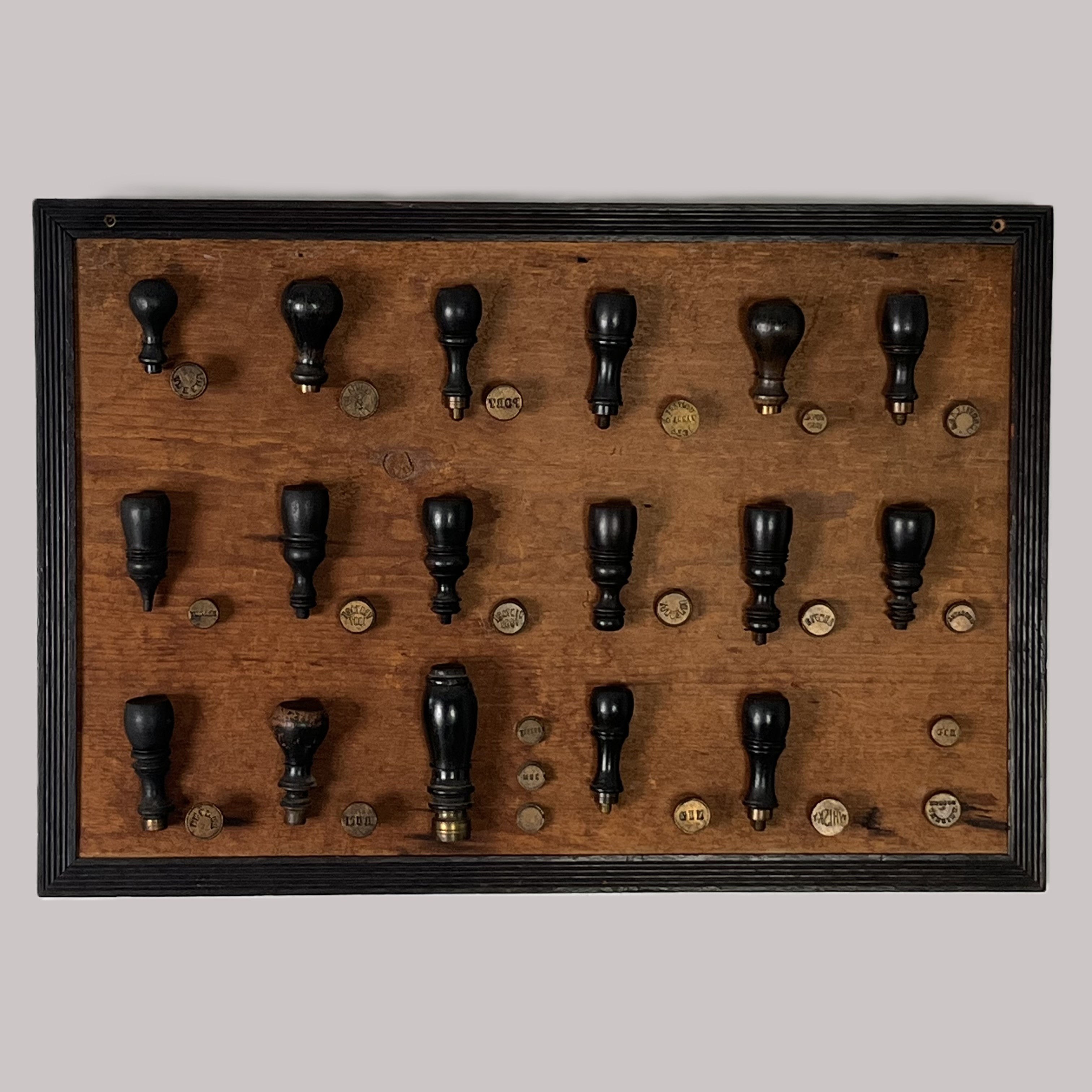 Framed Collection of Wine Bottle Wax Seal Stamps