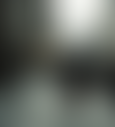 A young woman walks 1940s London streets with a suitcase