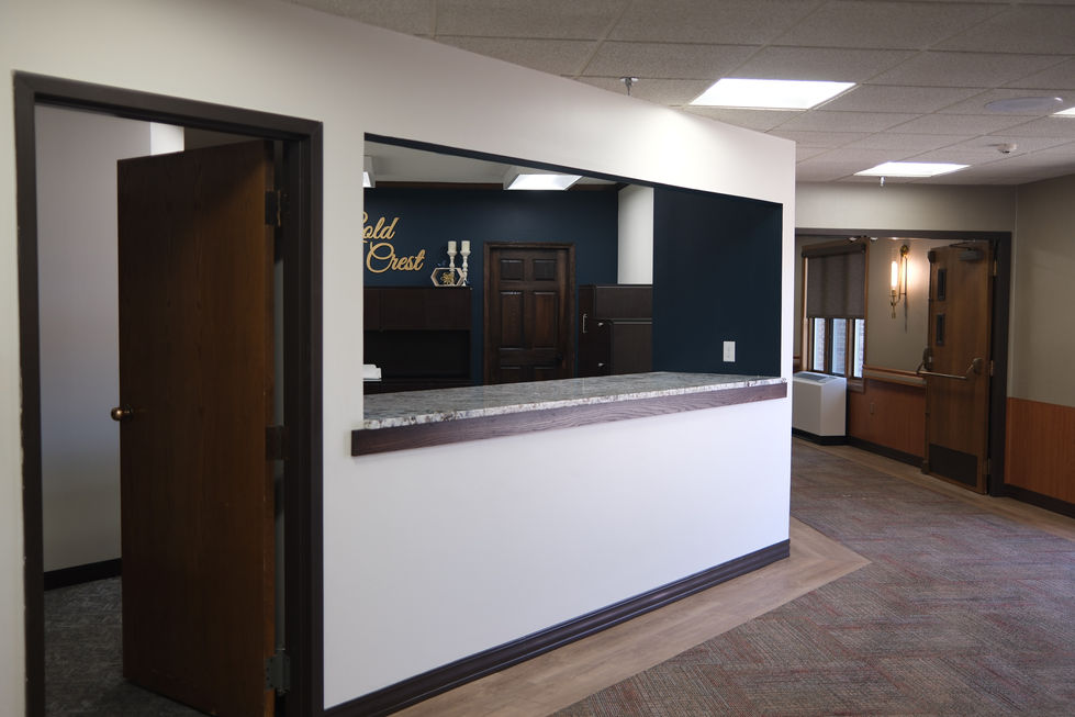 After image of a remodeled reception area with updated counter opening and modern finishes