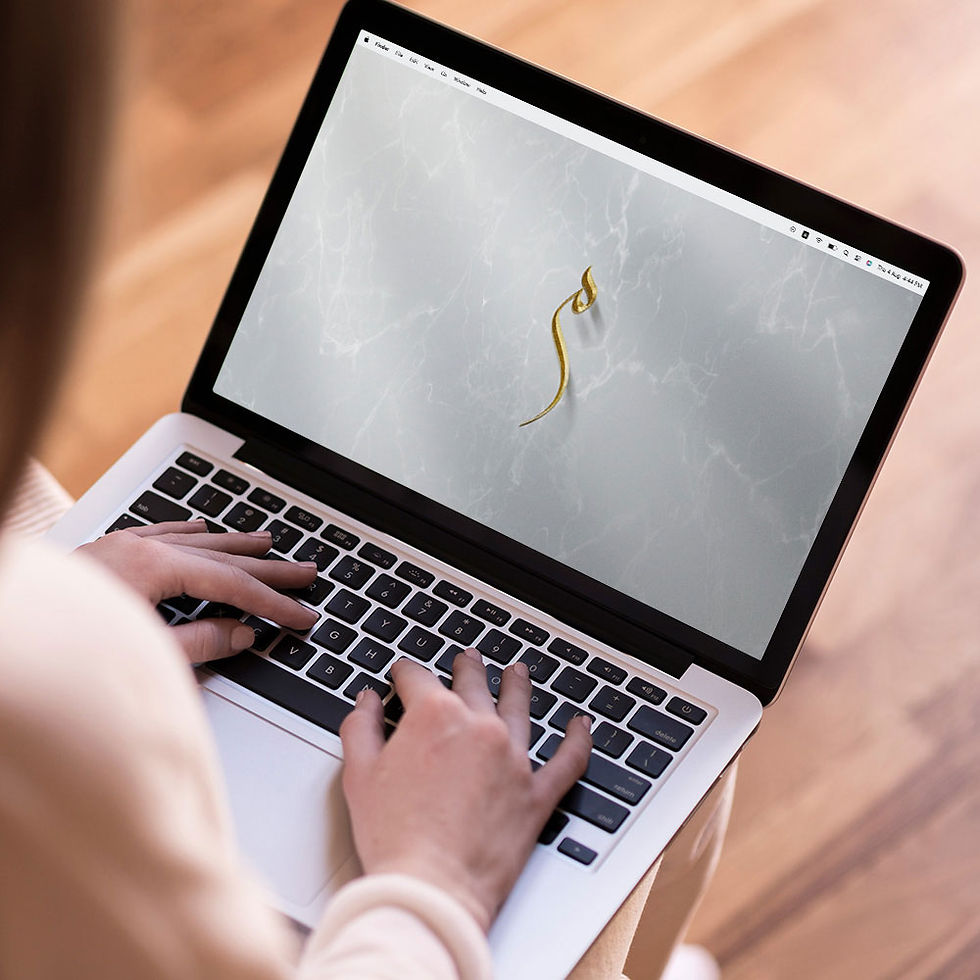 Letter M / Meem written in Arabic calligraphy in gold color stunningly used as laptop wallpaper