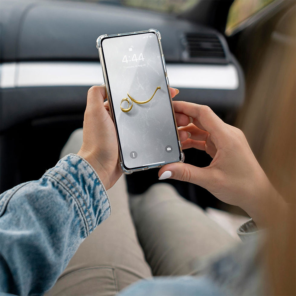 Thumbnail: Man holding phone with wallpaper showing letter S / Siin written in Arabic calligraphy in gold color