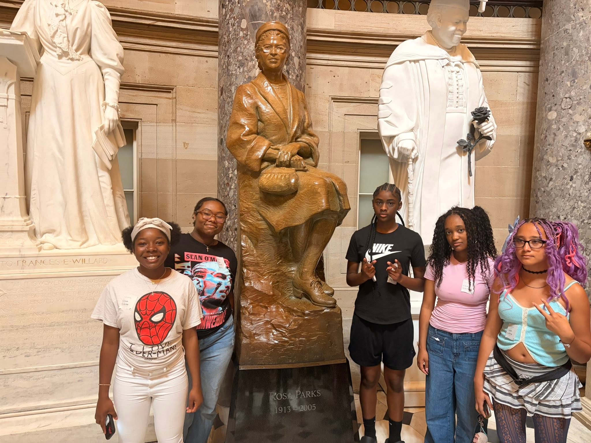 A happy group of students exploring a national museum in Washington DC together.