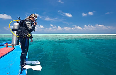Scuba Diver Preparing to Enter the Water From a Boat