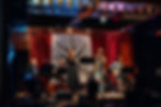 Eye-level view of a cozy coffee shop stage set up for a live performance