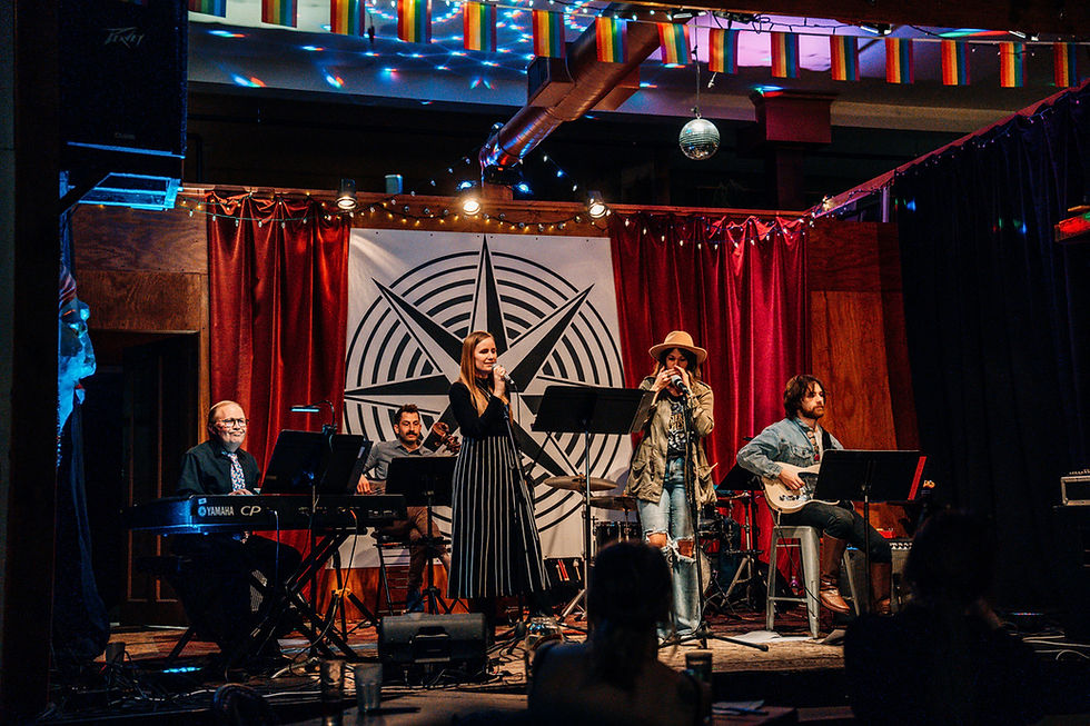 Eye-level view of a cozy coffee shop stage set up for a live performance