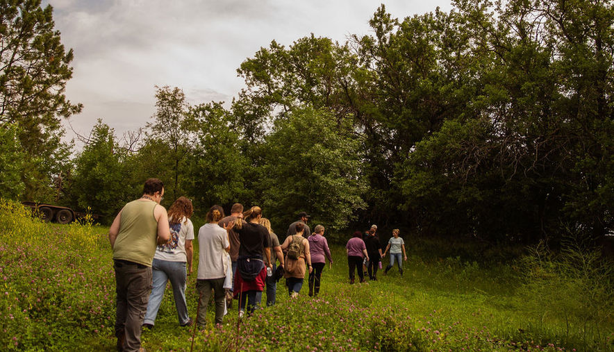 This is a photo of a group of people getting ready to walk on the sacred hiking trail during a vision workshop at Rock Creek ReTreet Center