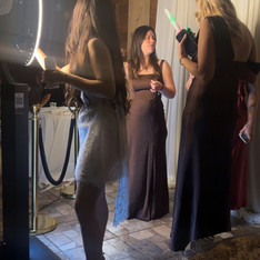 Guests posing with props at wedding photo booth rental in Austin TX