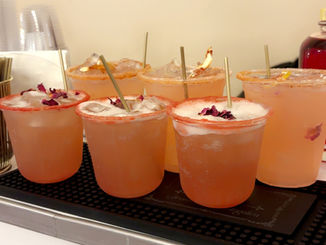 Several cocktails lined up, ready to serve on a bar, mobile bar rental Austin