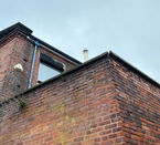 An upward perspective of a red brick building