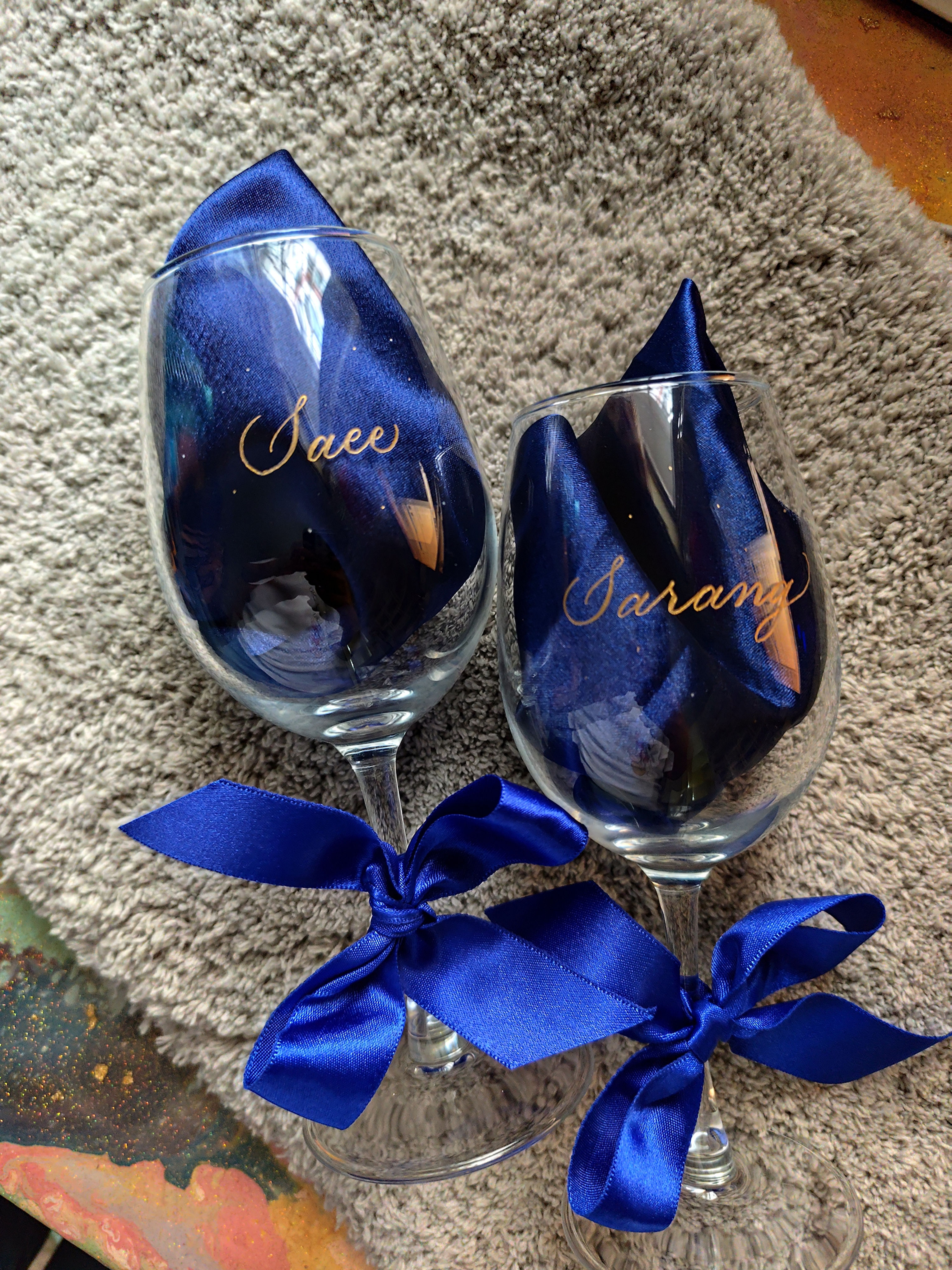 Elegant personalized wine glass with custom name engraving in calligraphy.