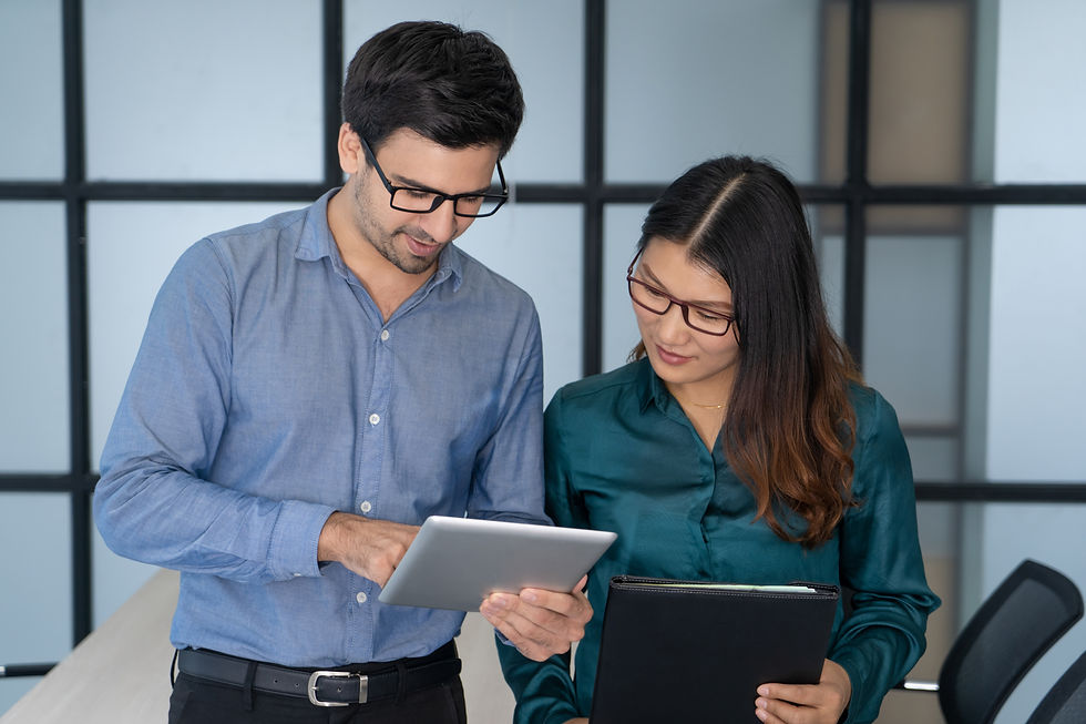 caucasian-supervisor-helping-new-asian-employee.jpg