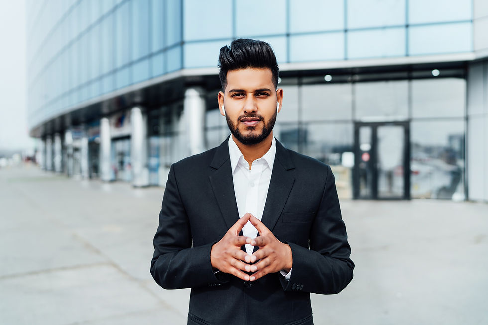 portrait-serious-smiling-modern-indian-man-near-office-building.jpg