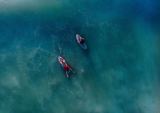 This is a picture of two peopl surfing on street artist ad graphic designer, Ivan Preciado's, website.