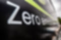 Close-up of Zero emission text on the side of a vehicle.