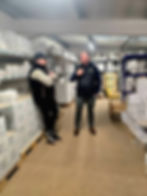 Anthony and Will talking in the warehouse