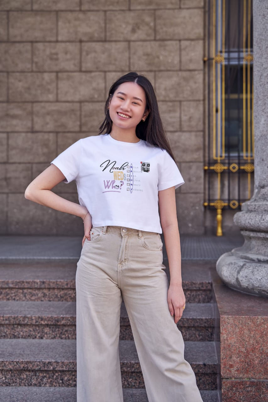 Woman in white "Nurturing" graphic tee