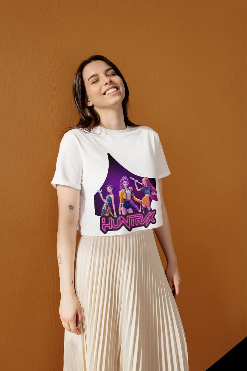 Woman smiling, wearing white crop top featuring K-pop group 'HIGH5IVE'