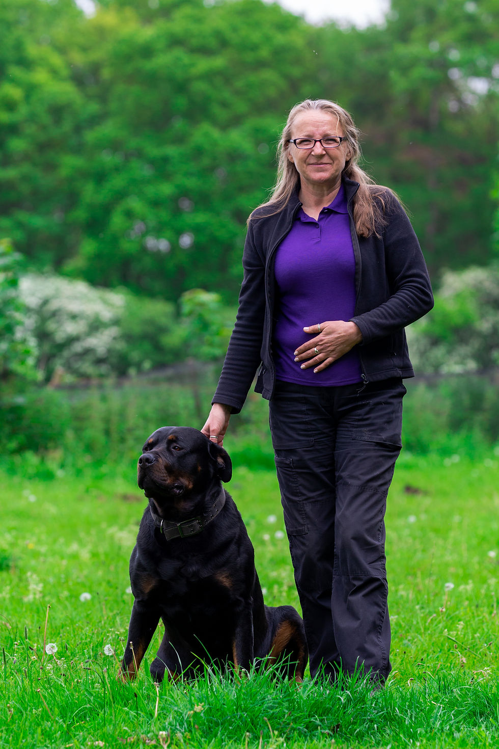 Sonia with her Rottweiler Harry in nature.