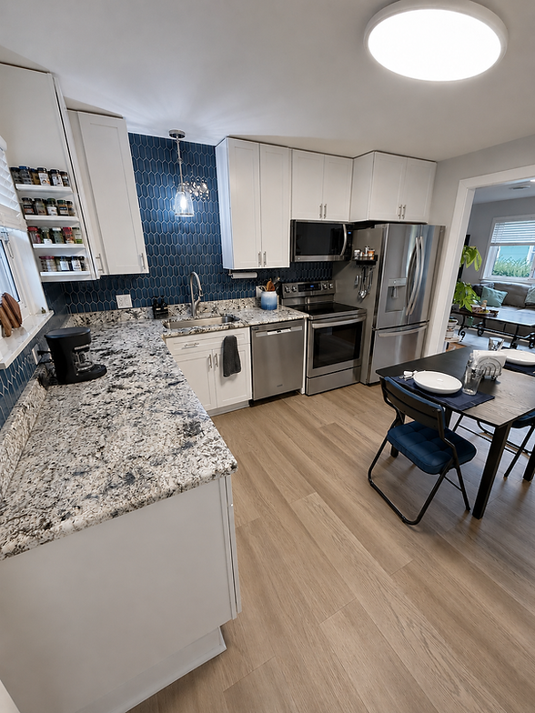 Modern kitchen with white cabinets and granite counters