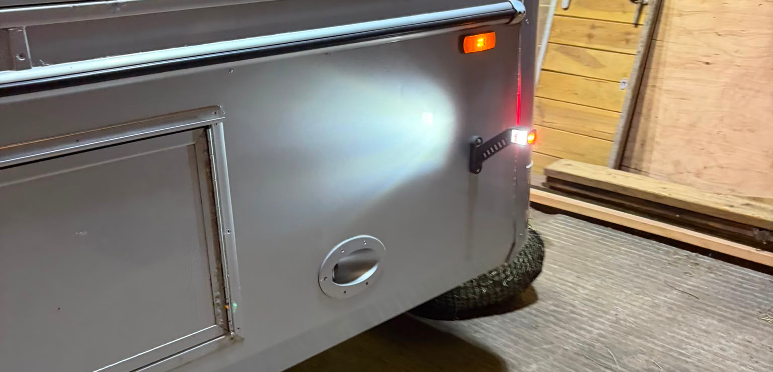 Side-mounted work and marker lighting providing improved visibility in low-light conditions.