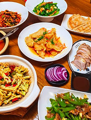 A lavish spread of authentic Northeast Chinese cuisine in Harbin. Featuring Guo Bao Rou crispy pork and local home-style dishes served family-style