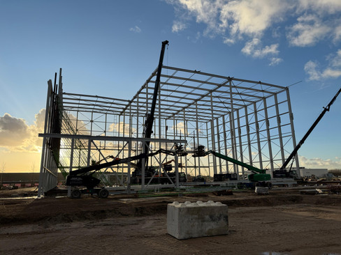 Construction site of the Quooker warehouse. Showing  the large steel structure and heavy machinery