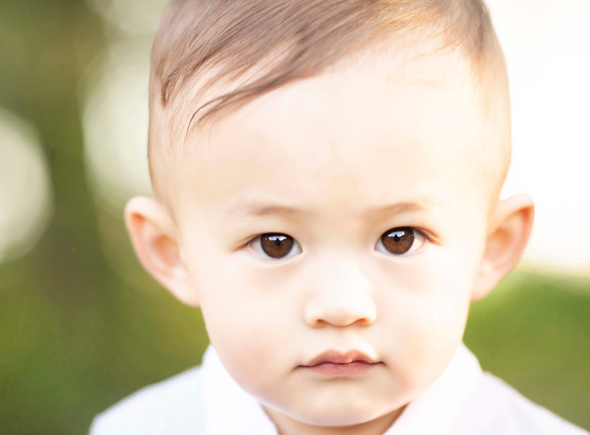 first birthday cake smash outdoors natural light little boy portrait