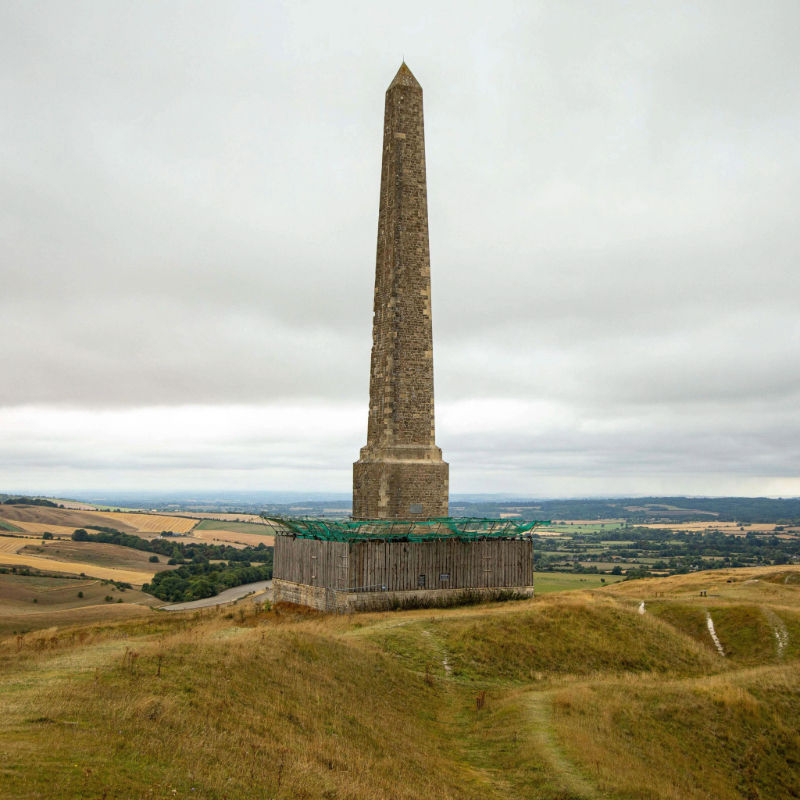 Landsdowne Monument standing atop a grassy hill near Calne, overlooking countryside and farmland.