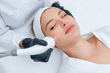 young-woman-receiving-laser-treatment-cosmetology-clinic.jpg
