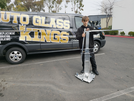 A professional conducting ADAS recalibration after windshield replacement.