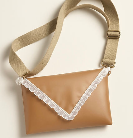 Custom leather bag featuring vintage lace design