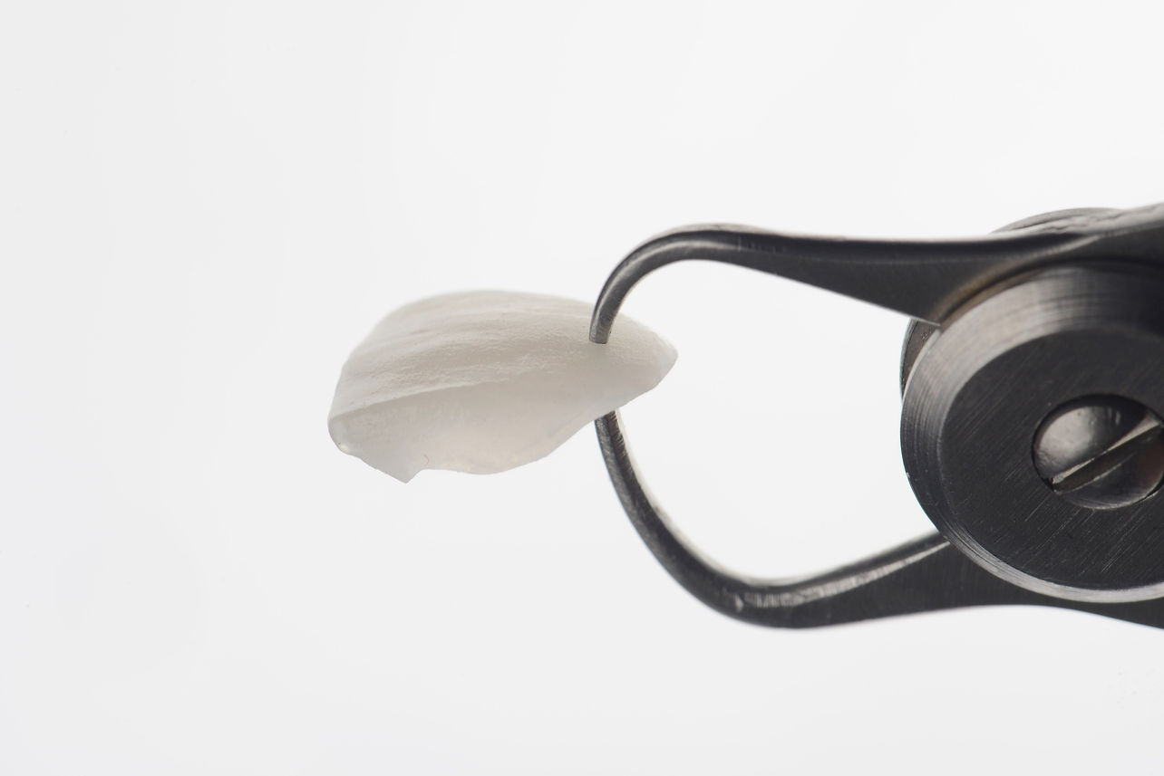 Super thin dental porcelain laminated veneer measurement with vernier caliper to show the 