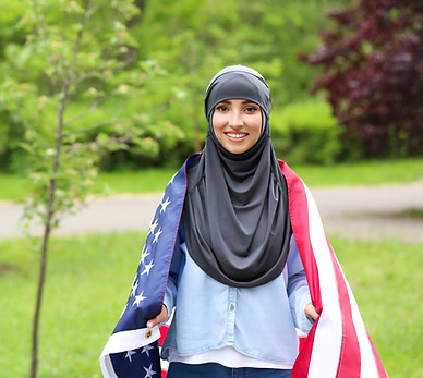 Muslim girl draped in American flag__Ado