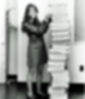 Margaret Hamilton, lead developer of the Appolo 11 software, standing next to the code
