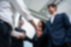 caucasian-businessman-making-a-handshake-together-2025-03-24-23-14-58-utc.jpg