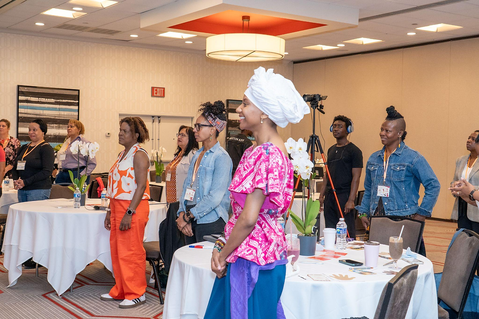 Group of participants standing and talking in a workshop