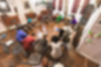 An image of individuals sitting around in a circle for a storytelling session