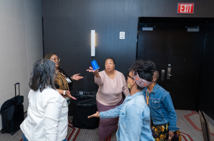 A group of participants engaged in a collaborative activity during a training session