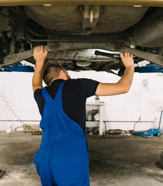 repairmen-examining-car-bottom_23-2147897937.jpg
