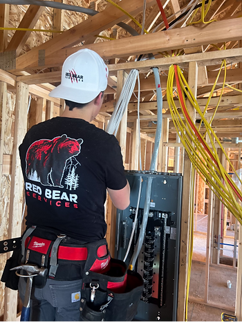 A man rewires a home professionally.